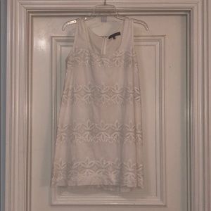 White dress with Details across the front.